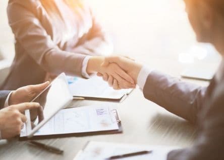 client and attorney handshake
