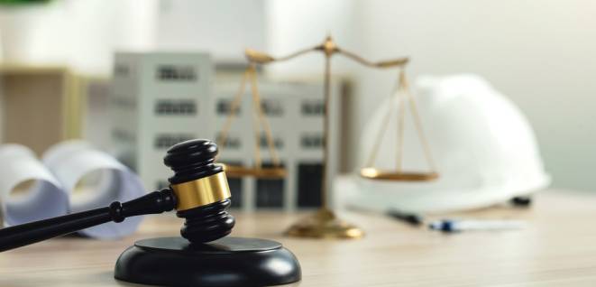 Labor, construction, and land law concepts. Judge gavel, scales of justice, protective helmet