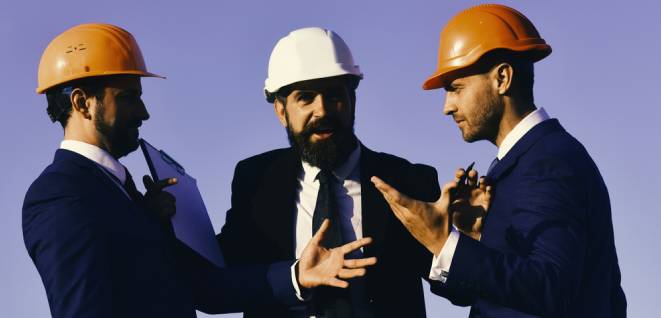 Architects hold clip folder. Construction and business concept. Men with beard and astonished faces have dispute